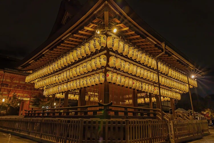 Yasaka Shrine illuminated by lanterns at night