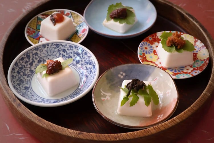 A tofu dish presented on a tray, in Arita-ware