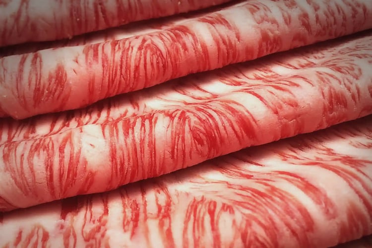 thinly sliced marbled Matsusaka beef for sukiyaki
