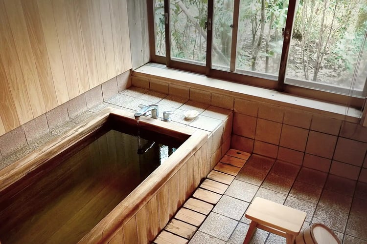 A private inn with a charming, traditional cypress bath