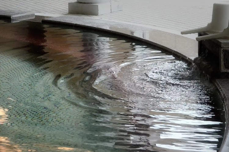 A large communal bath with free-flowing hot spring water