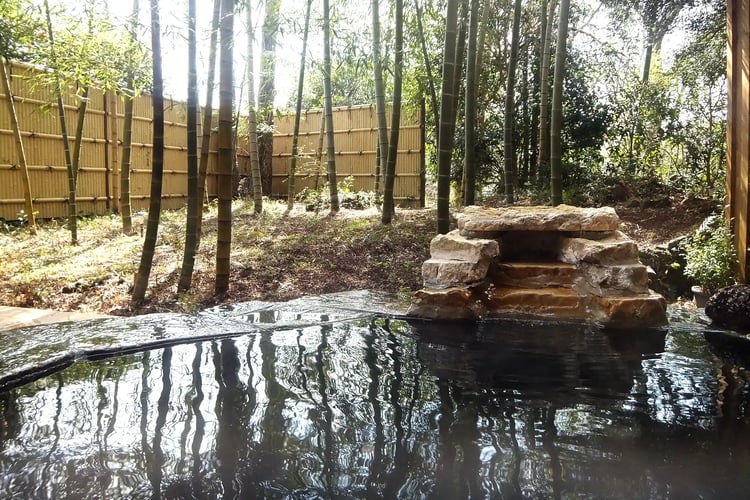 Private open-air onsen attached to the room