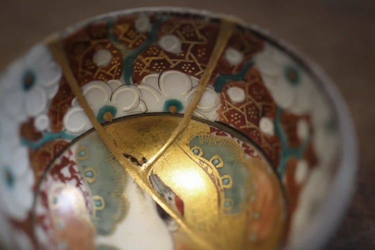 Kintsugi The Japanese art of repairing broken pottery with lacquer dusted or mixed with powdered gold, silver, or platinum