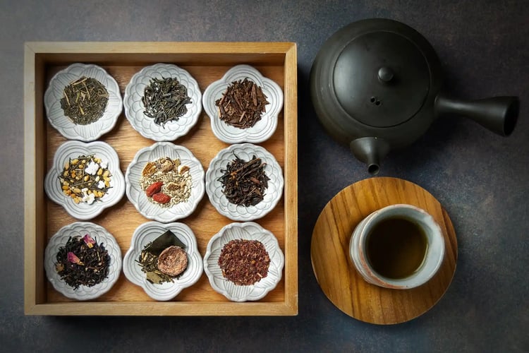 An assortment of various tea leaves arranged (or displayed)
