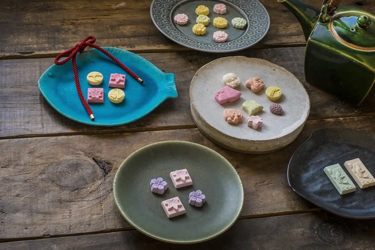 Wasanbon Japanese Sugar Candy Served with Various Plates and a Teapot