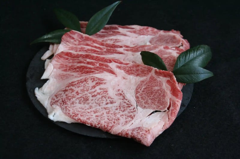 Wagyu loin sliced thin for sukiyaki, showing the marbling