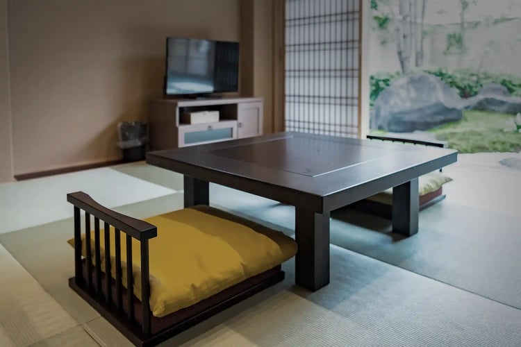 Japanese-style low chairs (Zaisu) and a low table on a tatami floor