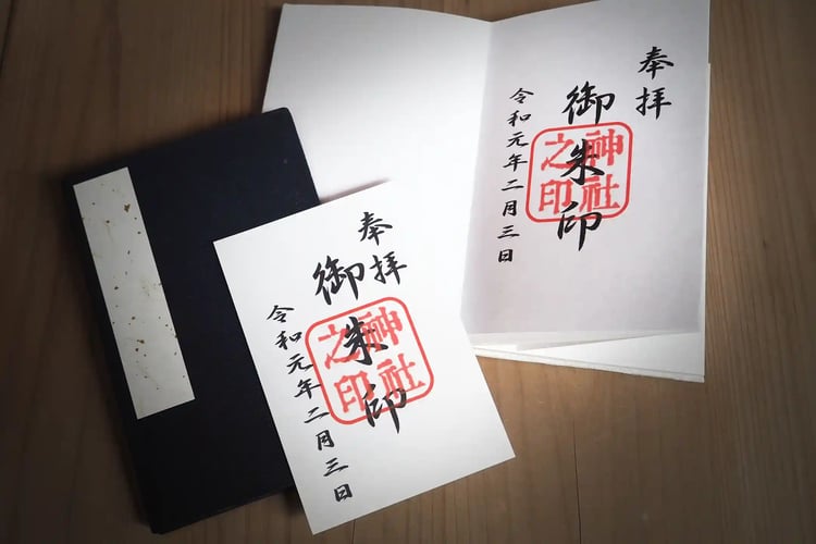 One Goshuin book, including a slip of paper with the goshuin