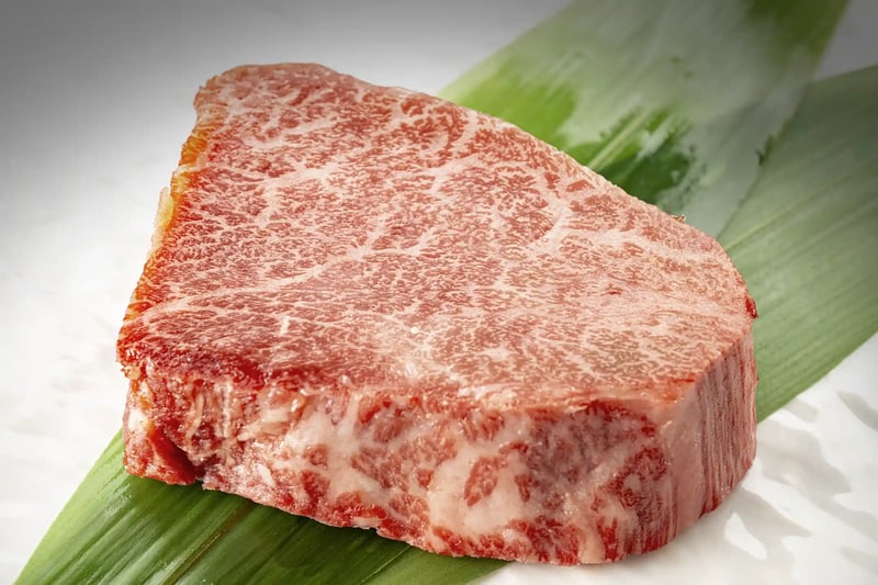 A thick steak placed on a plate