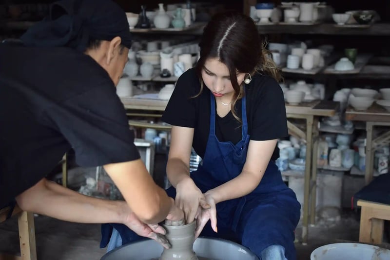 A foreign visitor taking a pottery class