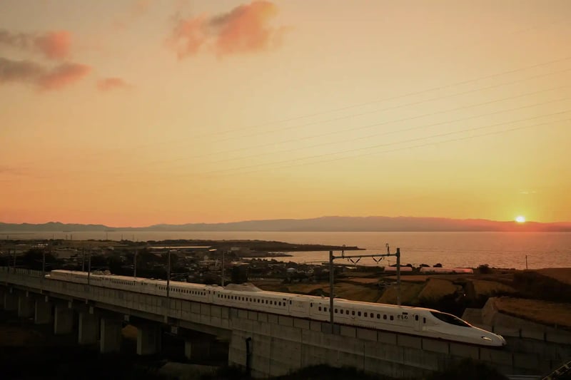 Sunset view of Omura Bay and the Shinkansen Kamome