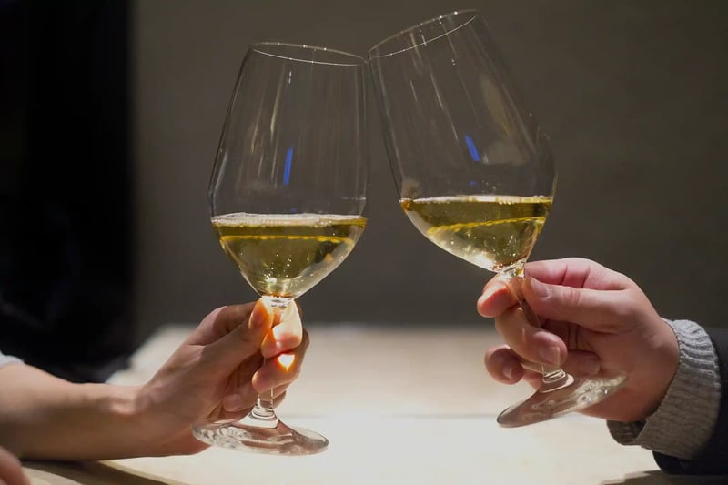 A toast to (something) with white wine