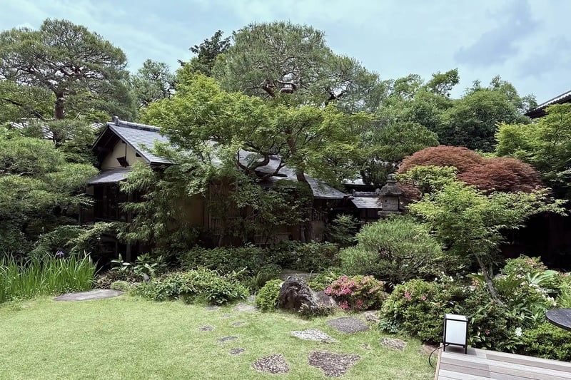 A Japanese-style house with a Japanese garden and a restaurant