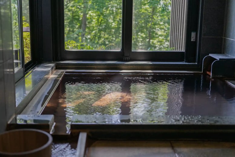 Open-air bath with a large window