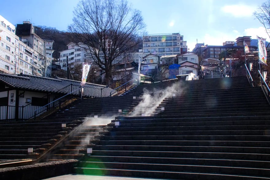 Ikaho Onsen_s stone step street, wrapped in billowing steam