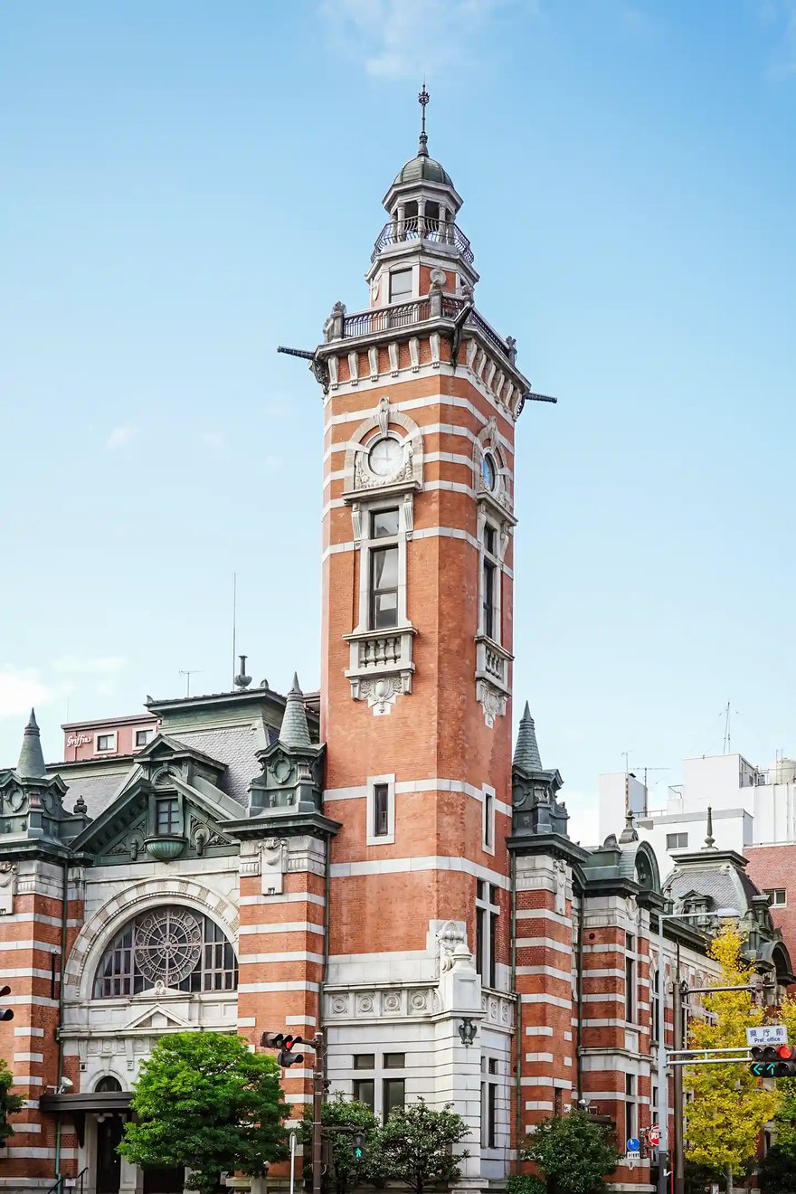 A magnificent red-brick building with a clock tower