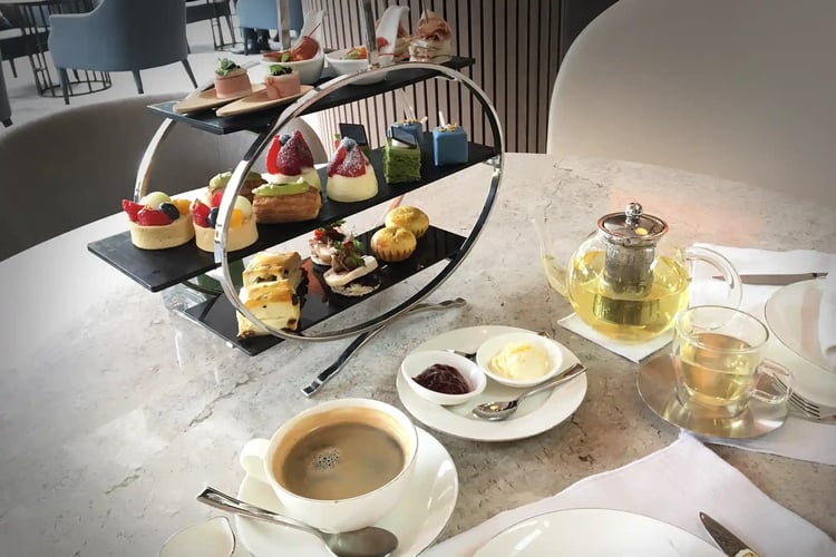 A luxurious afternoon tea with a selection of tea and coffee