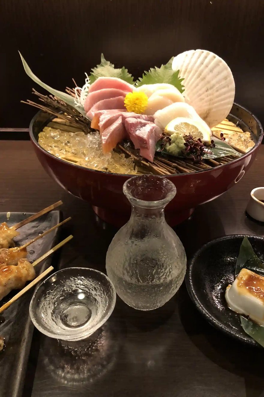 Enjoying Fresh Sashimi and Sake at a Local Izakaya