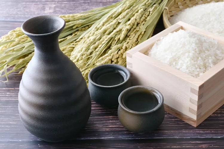 Japanese Sake with a Tokkuri (Carafe), Ochoko (Cups), and Rice Ears