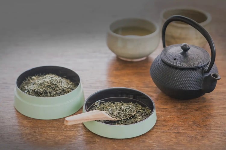 Tea time with tea leaves and a Nambu cast iron kettle