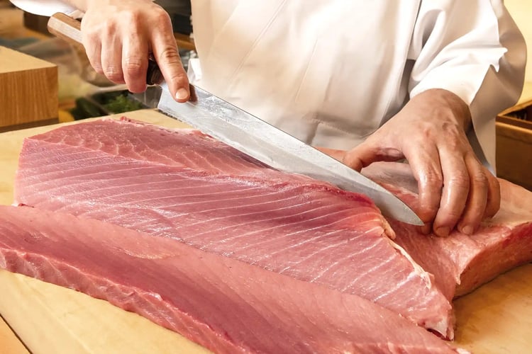 A Sushi Chef Filleting a Whole Tuna (Maguro)