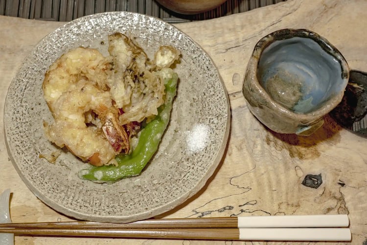 A Traditional Japanese Meal Set Sushi, Tempura, and Chawanmushi