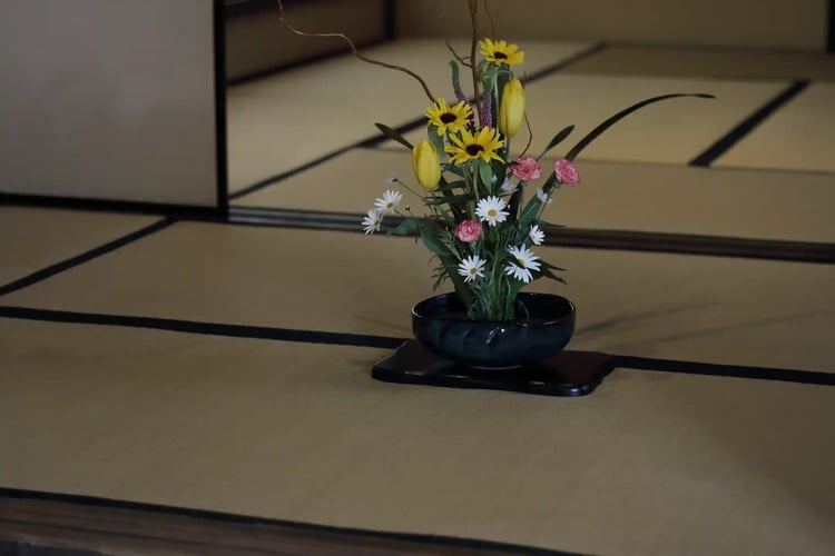 The atmosphere of harmony, respect, purity, and tranquility, along with ikebana