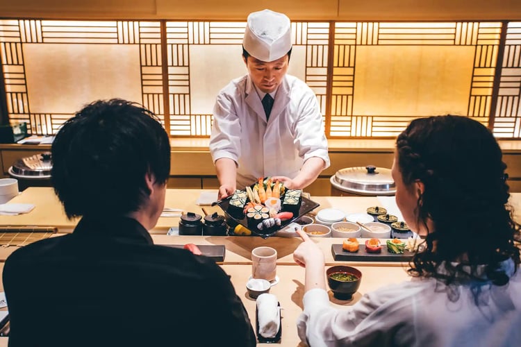 Woman and Man Eating Sushi