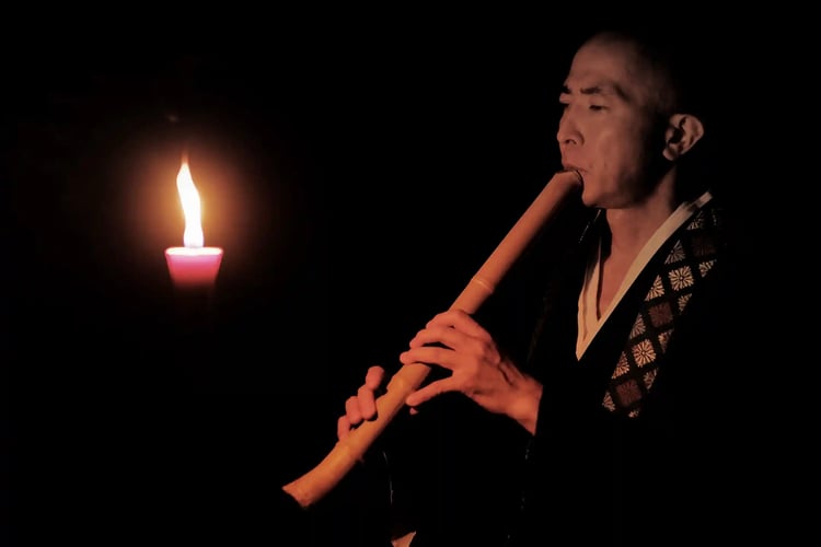 A Japanese monk playing the shakuhachi