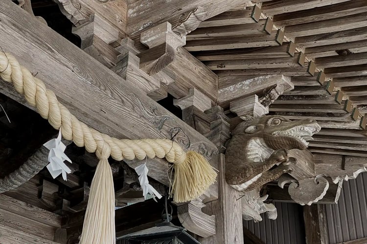 The face of a wooden dragon, expertly carved by a master shrine and temple carpenter