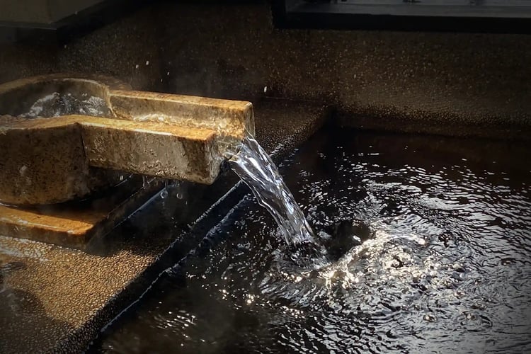 Gushing hot spring water from the source