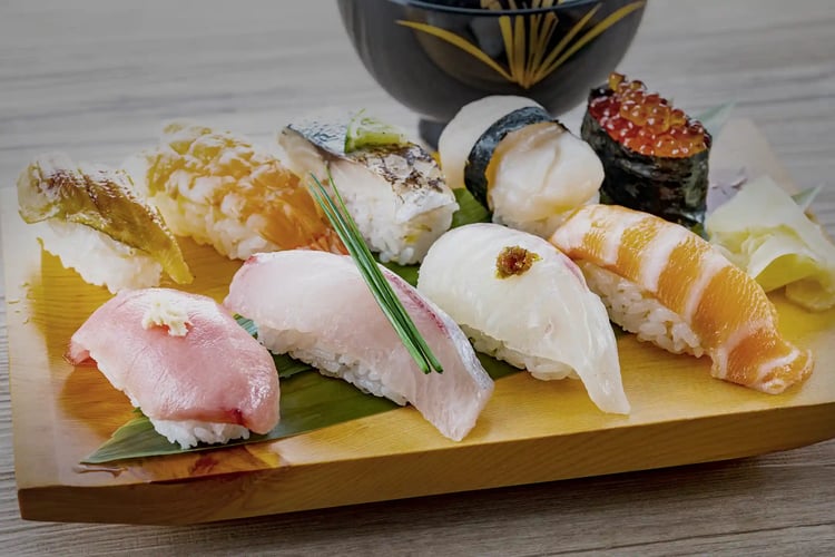 Assorted nigiri sushi served on a plate