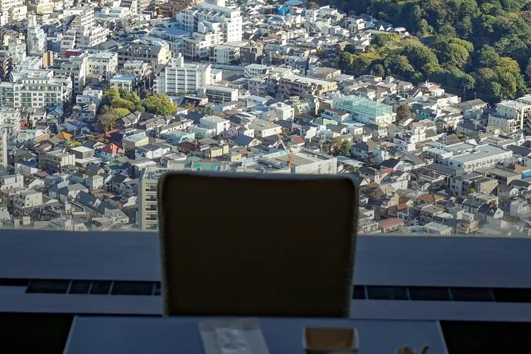 A restaurant seat and a city view