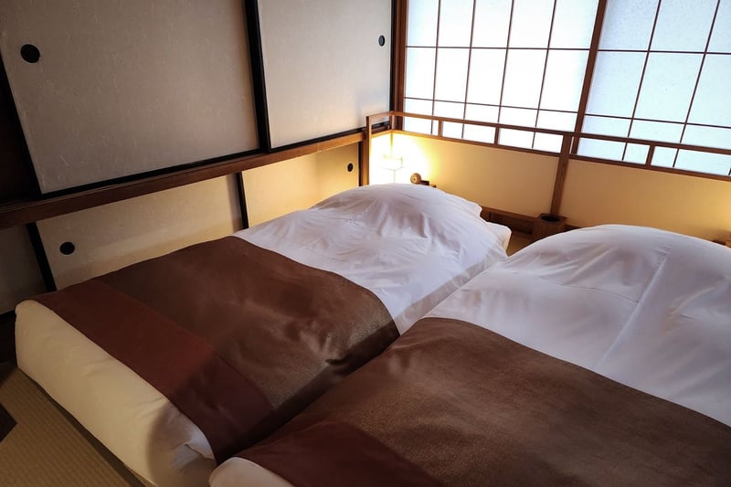 A guest room at Kayotei with a view onto the garden