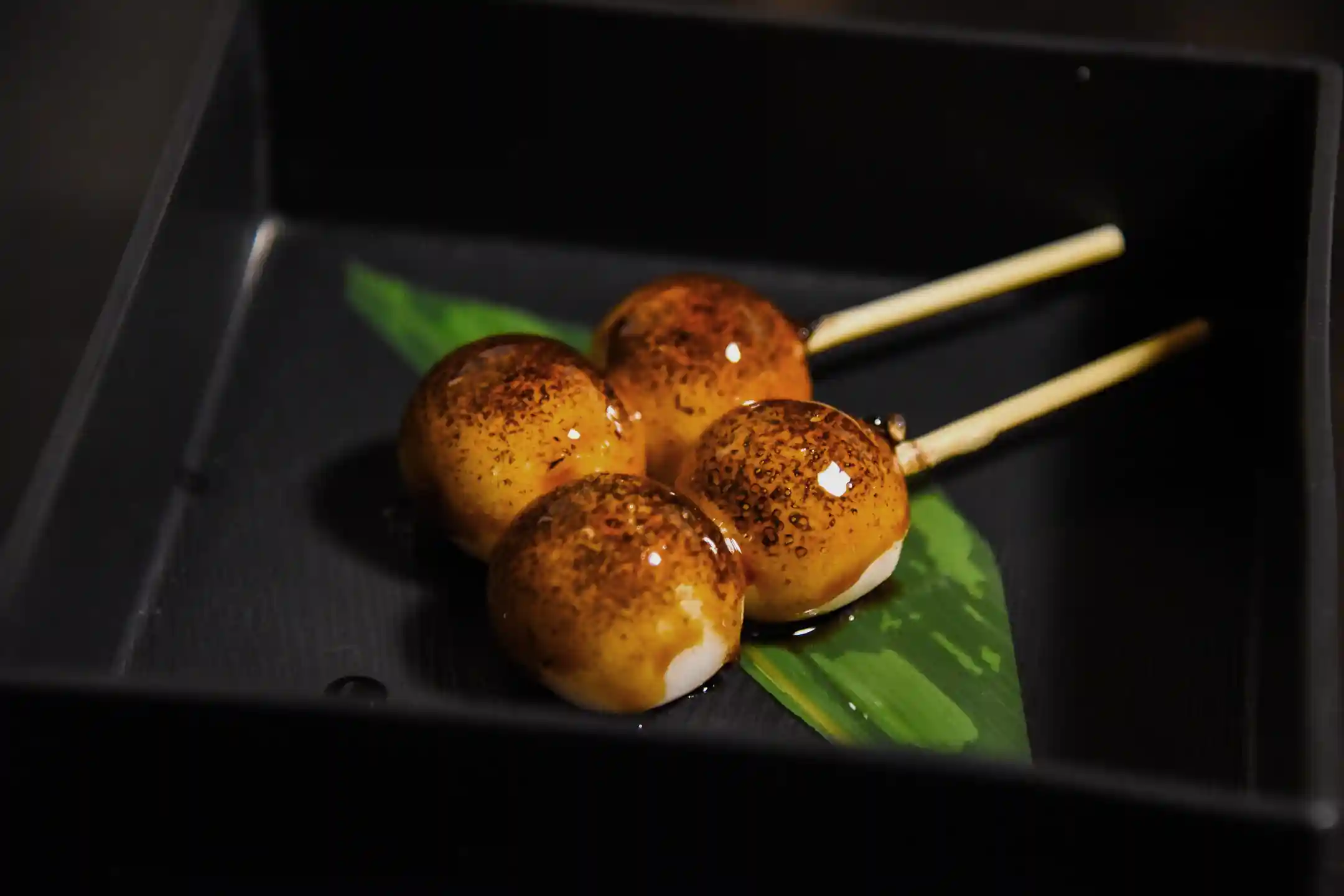 Mitarashi dango glazed with sweet soy sauce and lightly grilled