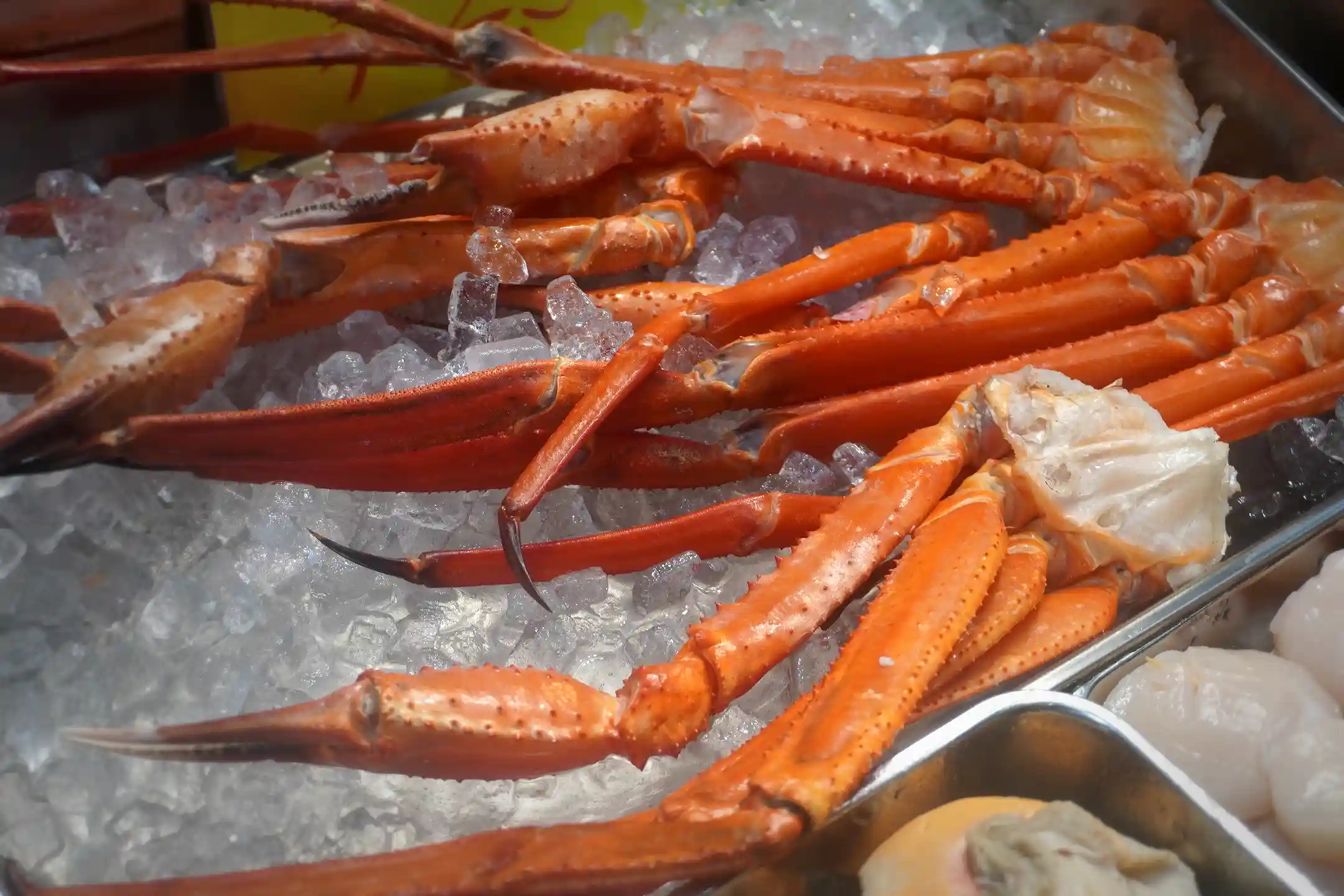 King crab legs displayed at a Kuromon Ichiba Market seafood stall