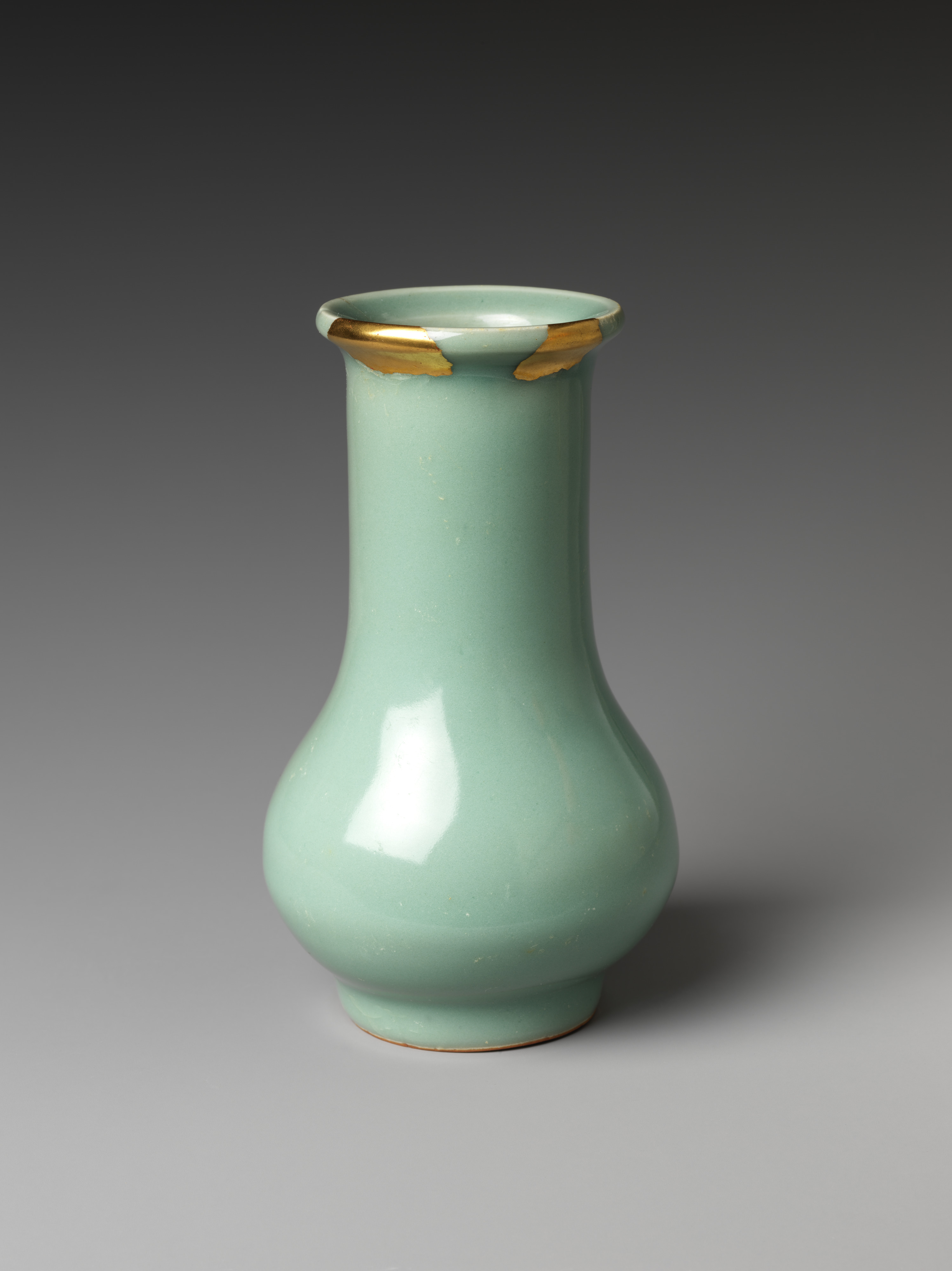A thirteenth-century Longquan celadon bottle vase in the Metropolitan Museum of Art, catalogued with gold lacquer repairs