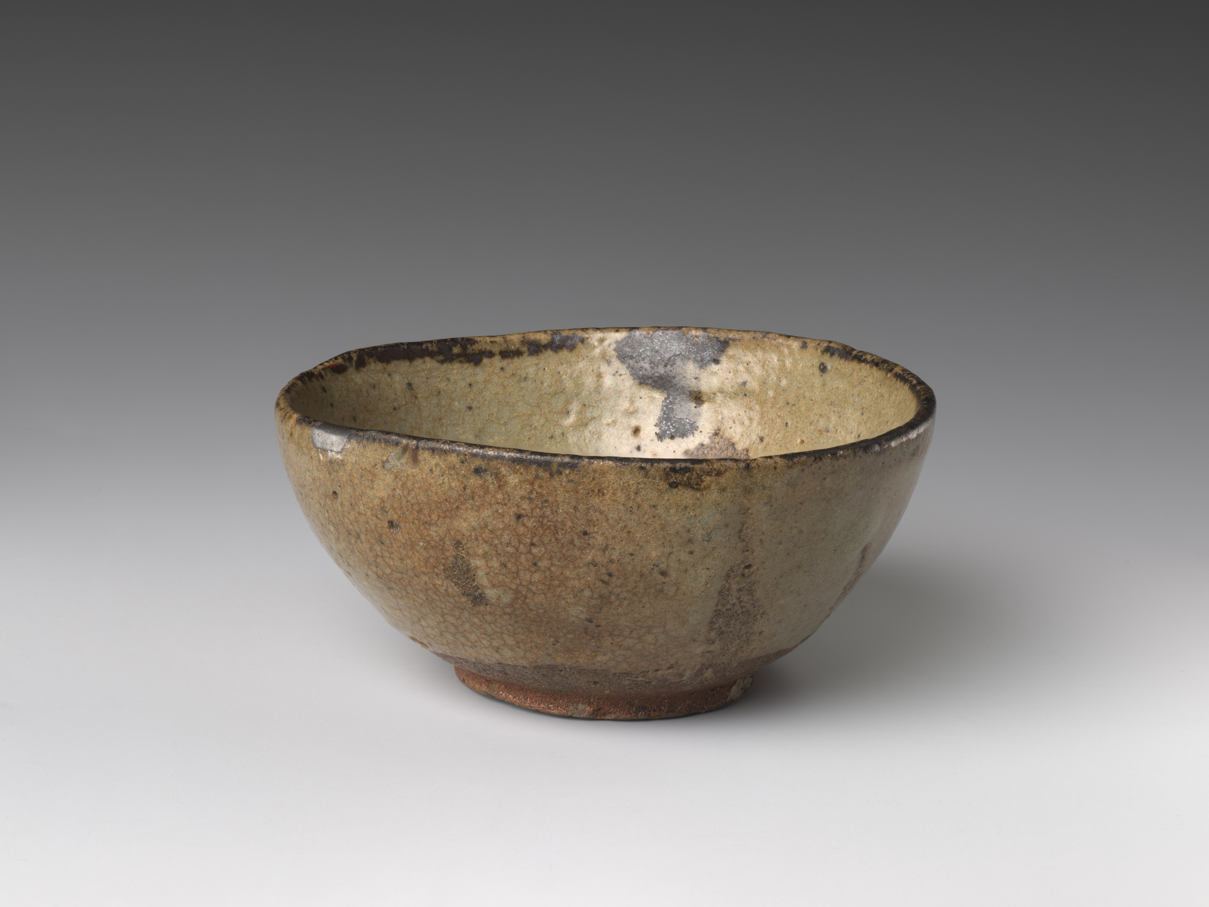 An early seventeenth-century Karatsu sake cup in the Metropolitan Museum of Art, catalogued with silver lacquer repairs