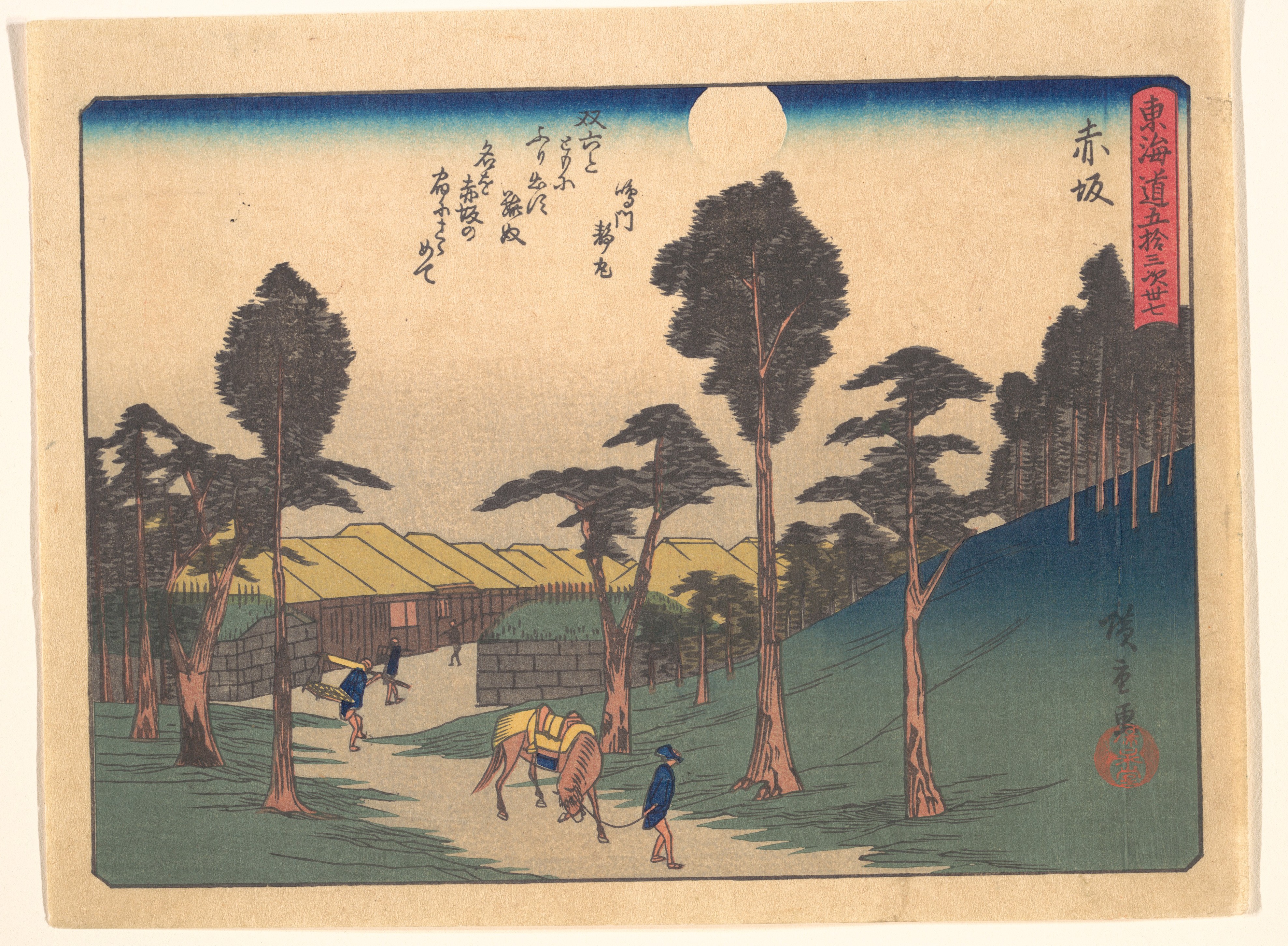 A Hiroshige print of Akasaka by moonlight: a horse being led along a road lined with pines, with the thatched roofs of the post town behind a wall
