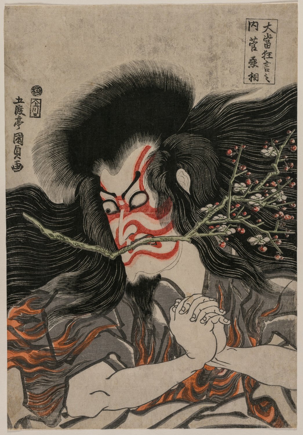 A woodblock print of the kabuki actor Ichikawa Danjūrō VII with red-and-white kumadori makeup painted on his face, wild hair and a spray of plum blossom held in his teeth