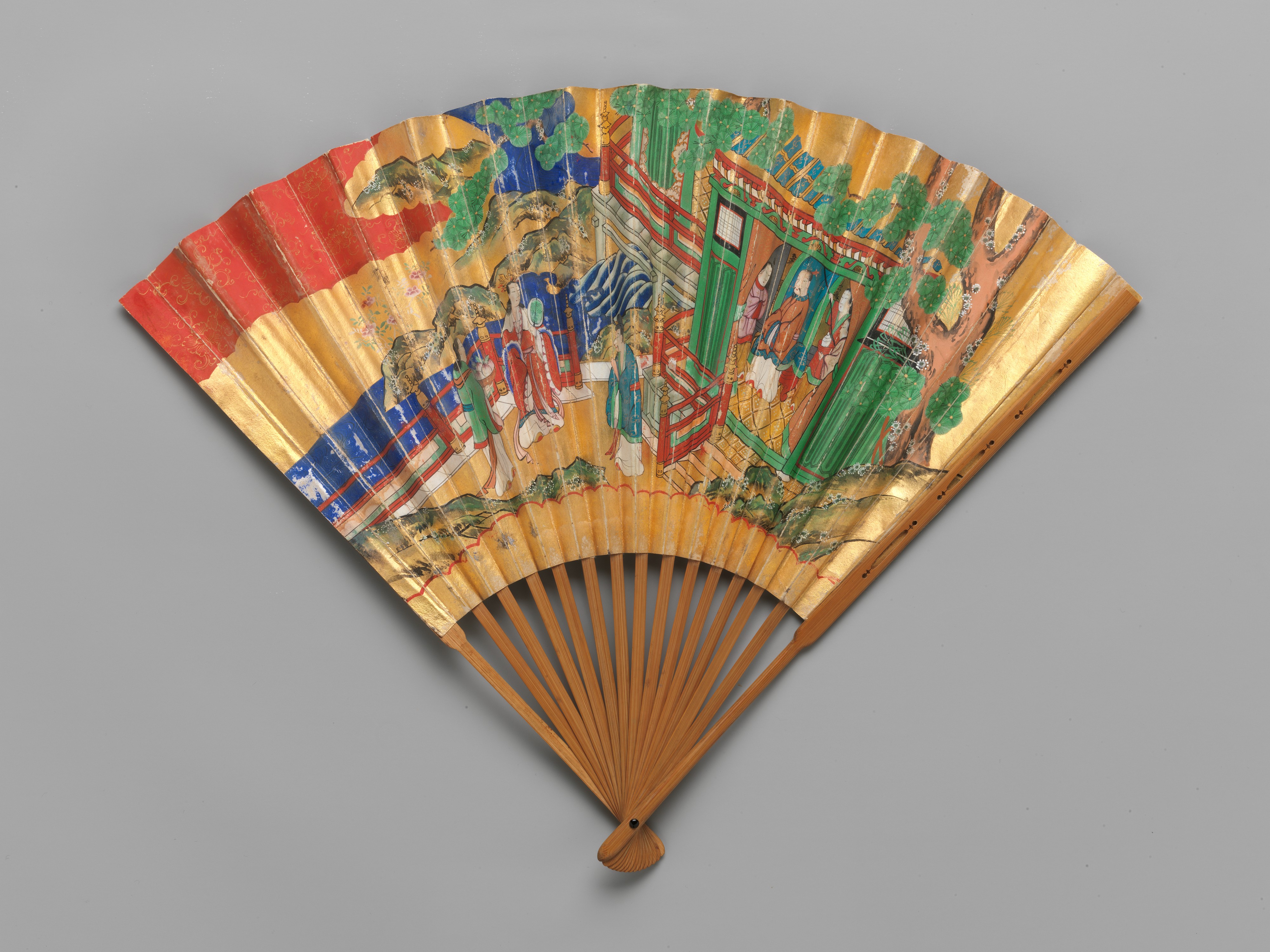 A chukei, the folding fan used in noh and kyogen, opened to show its gold ground and bamboo ribs