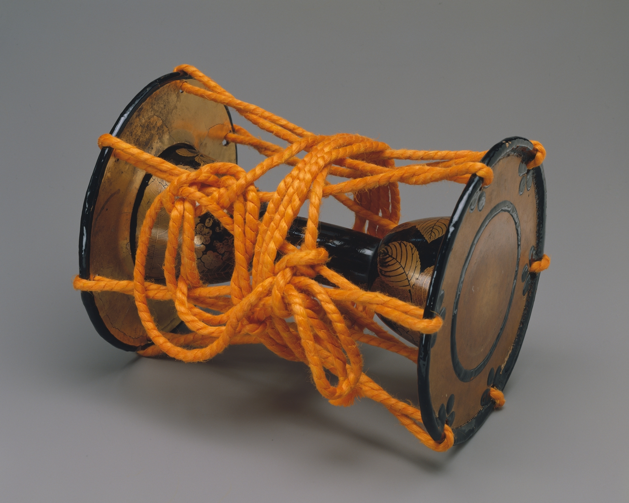 A small shoulder drum for noh performance, lacquered wood with gold decoration, in the Metropolitan Museum of Art
