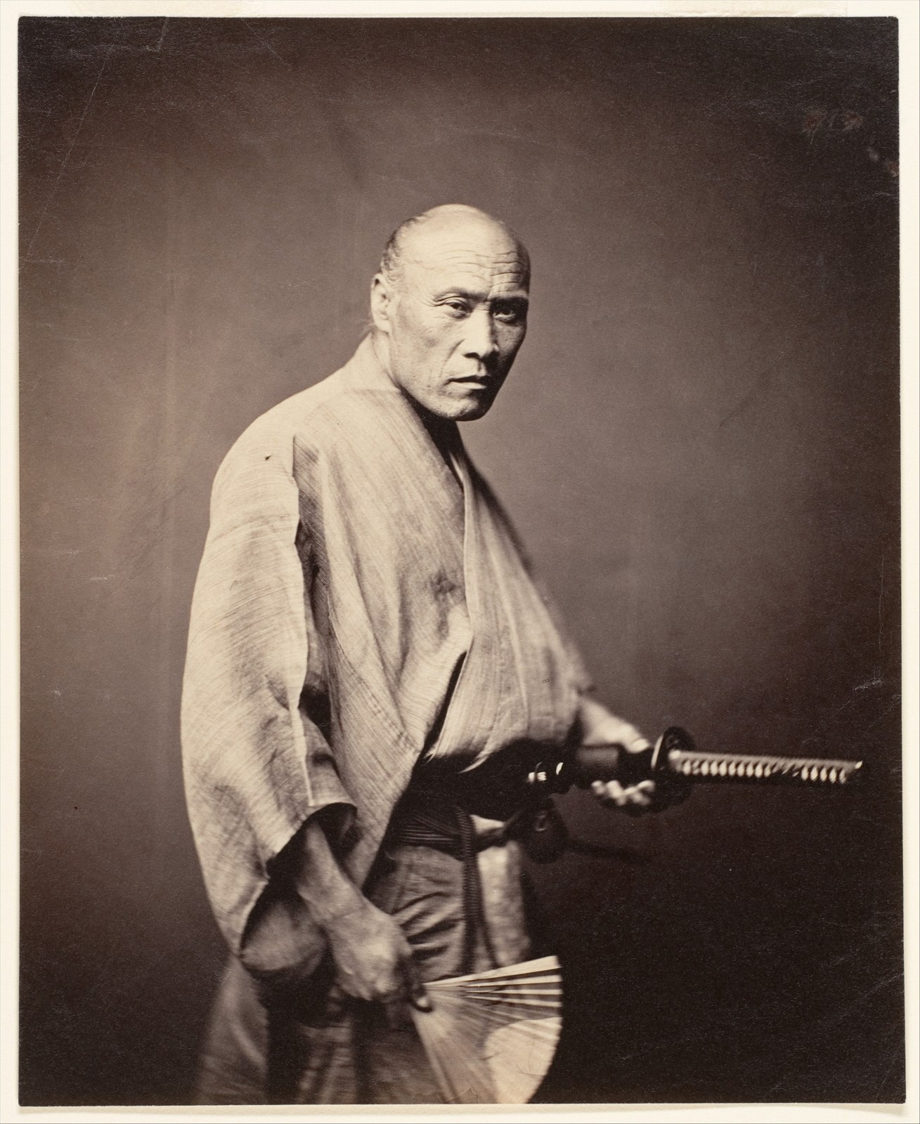 A samurai in armour and helmet photographed by Felice Beato in Yokohama in the 1860s