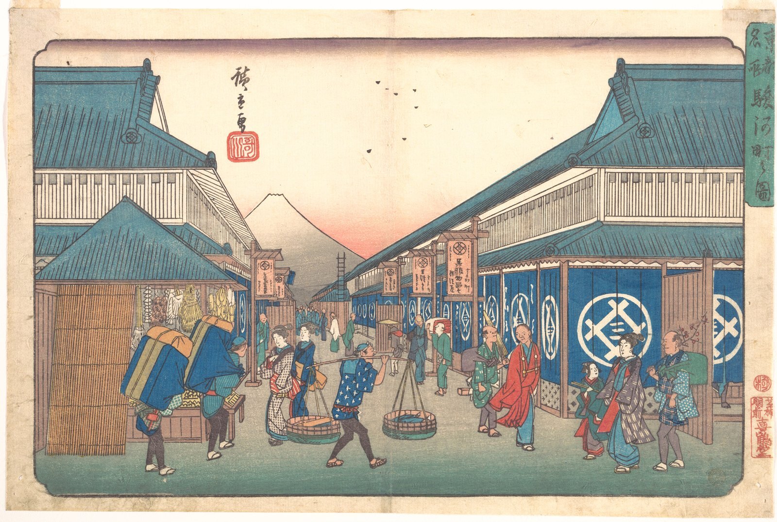 A woodblock print of a busy Edo street of merchant shopfronts under a clear sky